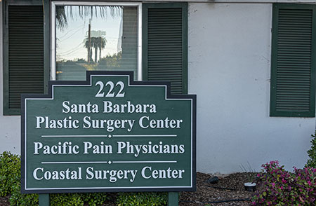 Custom address signs mounted on exterior wall, bold, high-contrast house numbers for homes and businesses