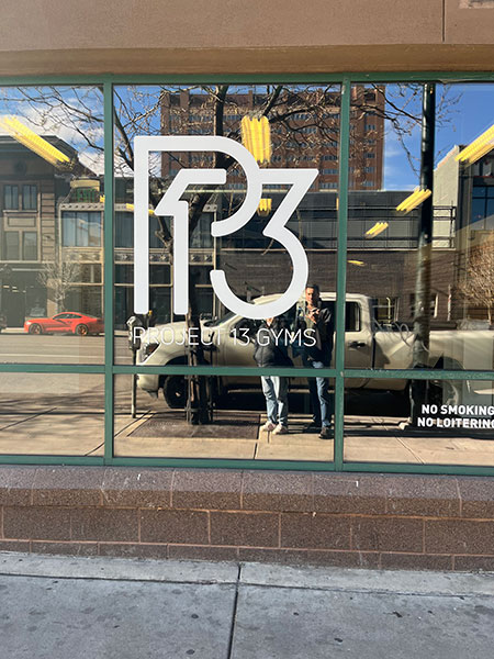 Custom vinyl lettering displaying bold, clean typography applied to a smooth surface for professional business branding