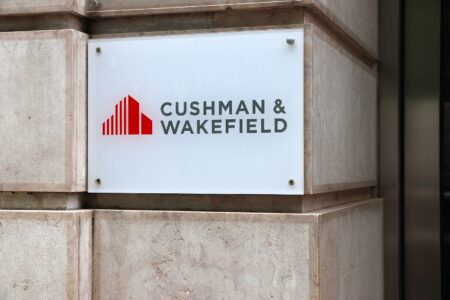 Cushman & Wakefield office signage on modern building facade in Lisbon, Portugal, June 2018.