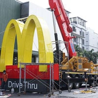 On-site installation of a commercial sign by an experienced technician using proper tools and equipment