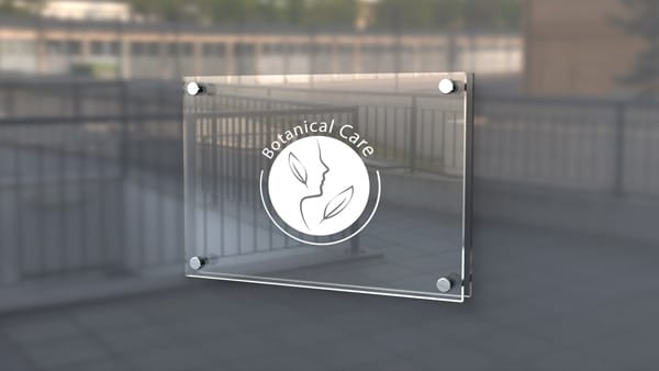 Custom acrylic sign on clear panel showcasing professional business branding in Aurora, Colorado.