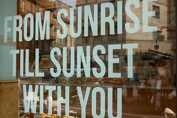 Professional window graphic on a storefront in Aurora, CO, showcasing custom branding and vinyl signage.