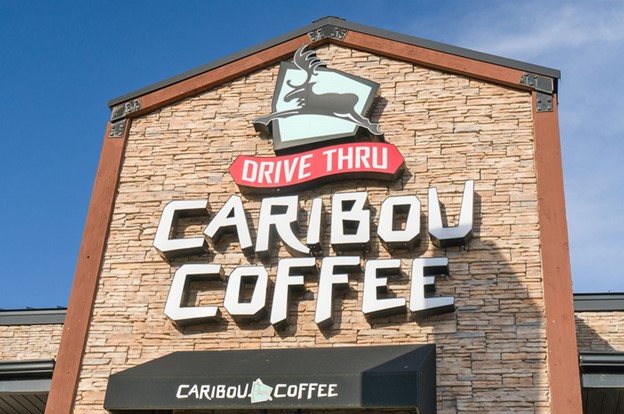 Bold commercial building signage with large lettering mounted on the exterior facade to boost visibility