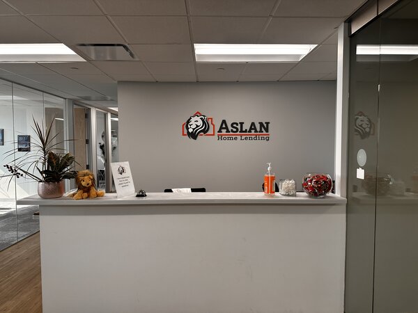 ASLAN Home Lending office featuring personalized acrylic signs installed in Denver, Colorado.