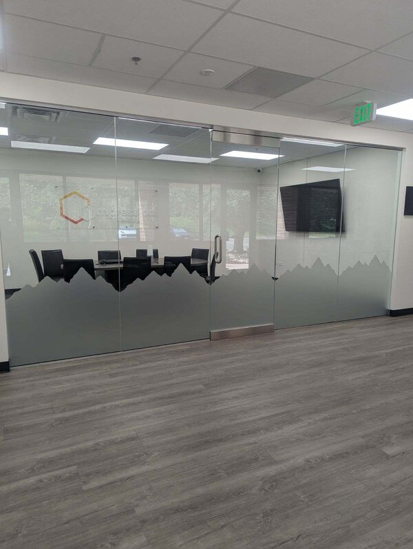 Commercial window tinting applied to Denver office building glass to reduce glare and enhance privacy.