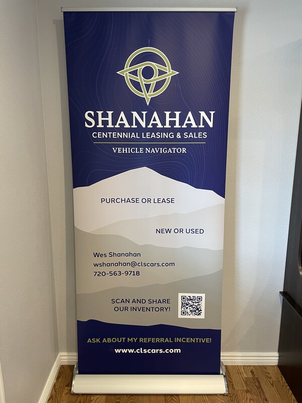 Professional retractable banner stands with custom graphics, ideal for trade shows and retail displays in Denver, CO