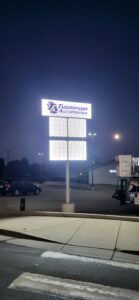 Thompson Automotive building facade before custom commercial signage installation