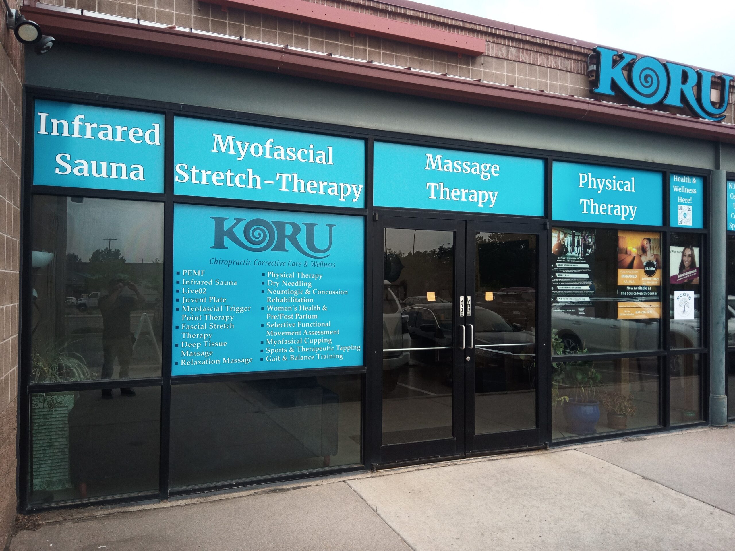 Professional custom vinyl signage on a business storefront, showcasing branding on glass windows