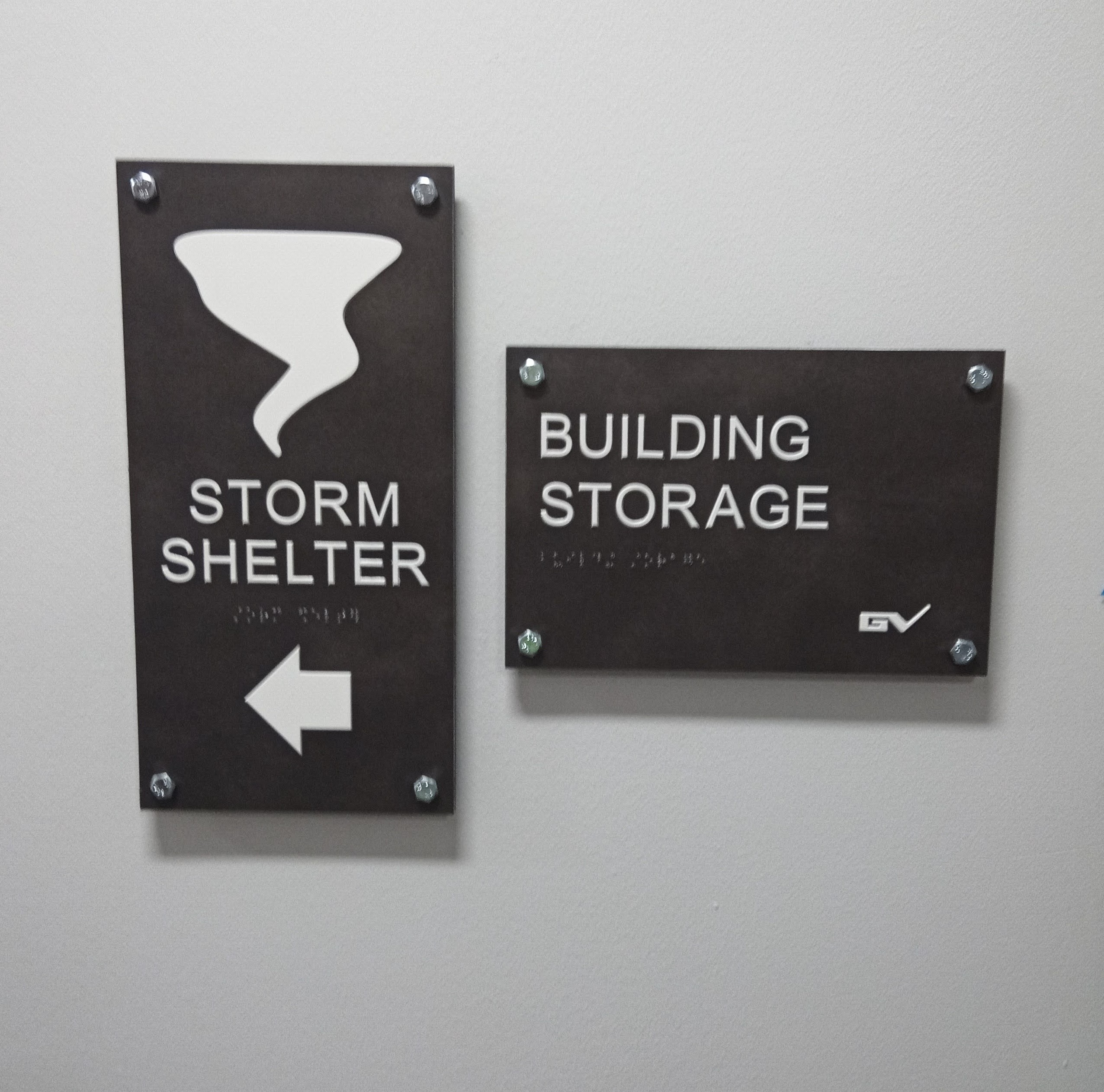 Exterior building facade with professional business signage delivering results, showcasing company name and logo