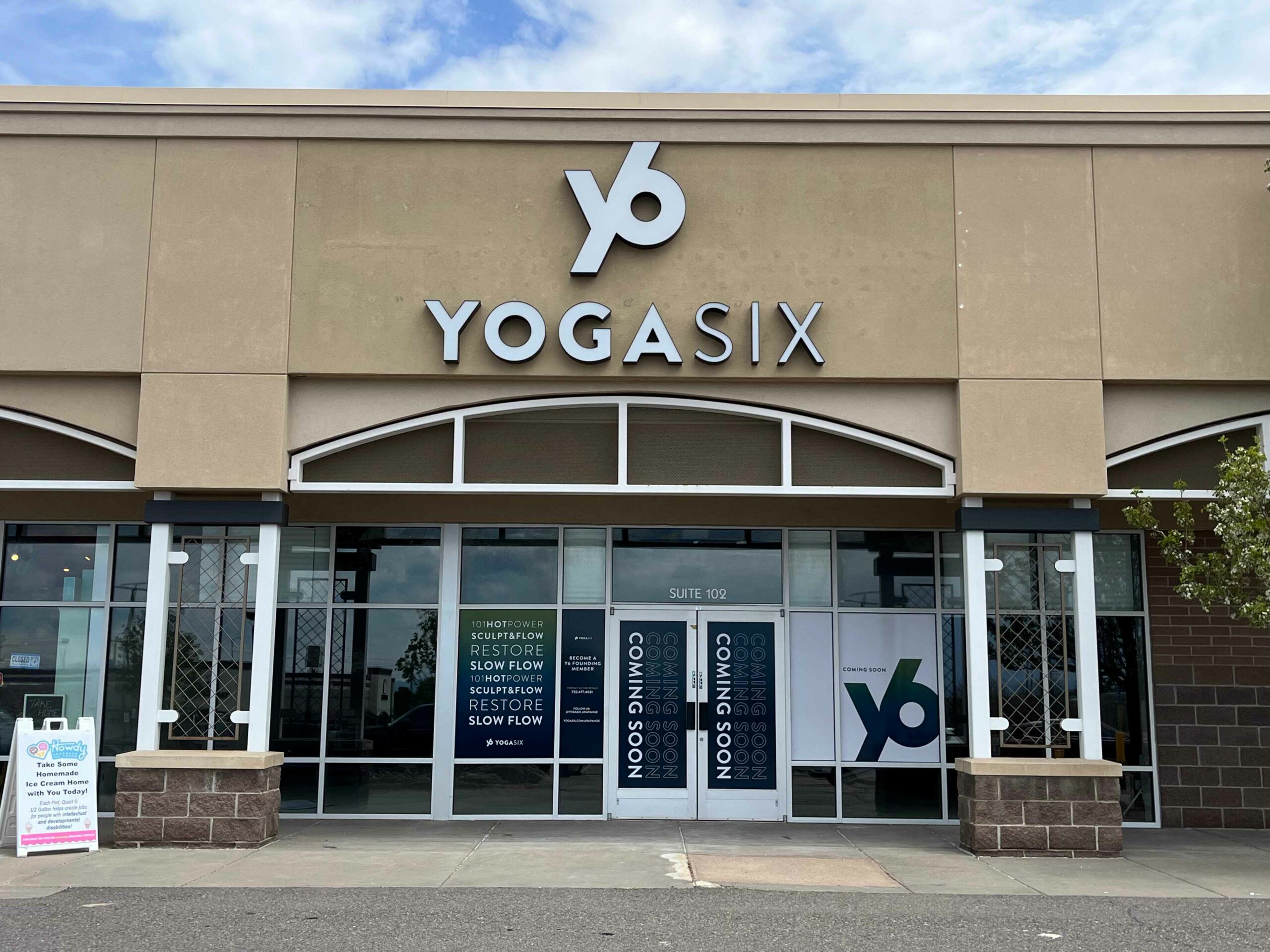 Custom business sign with bold graphics, professionally fabricated to enhance brand visibility and attract customers.