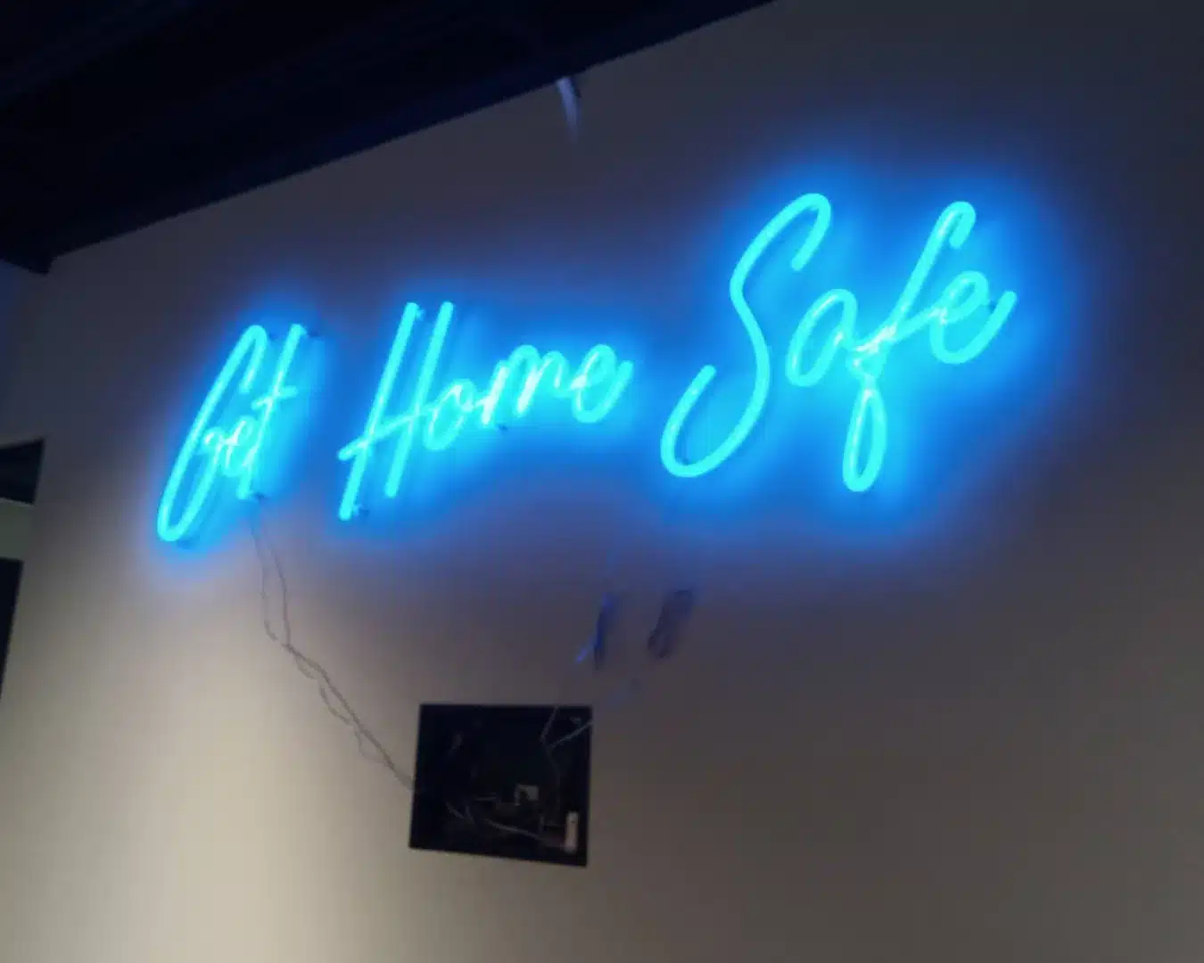 Bright custom LED sign at a trade show booth, highlighting brand messaging for maximum visibility and impact.