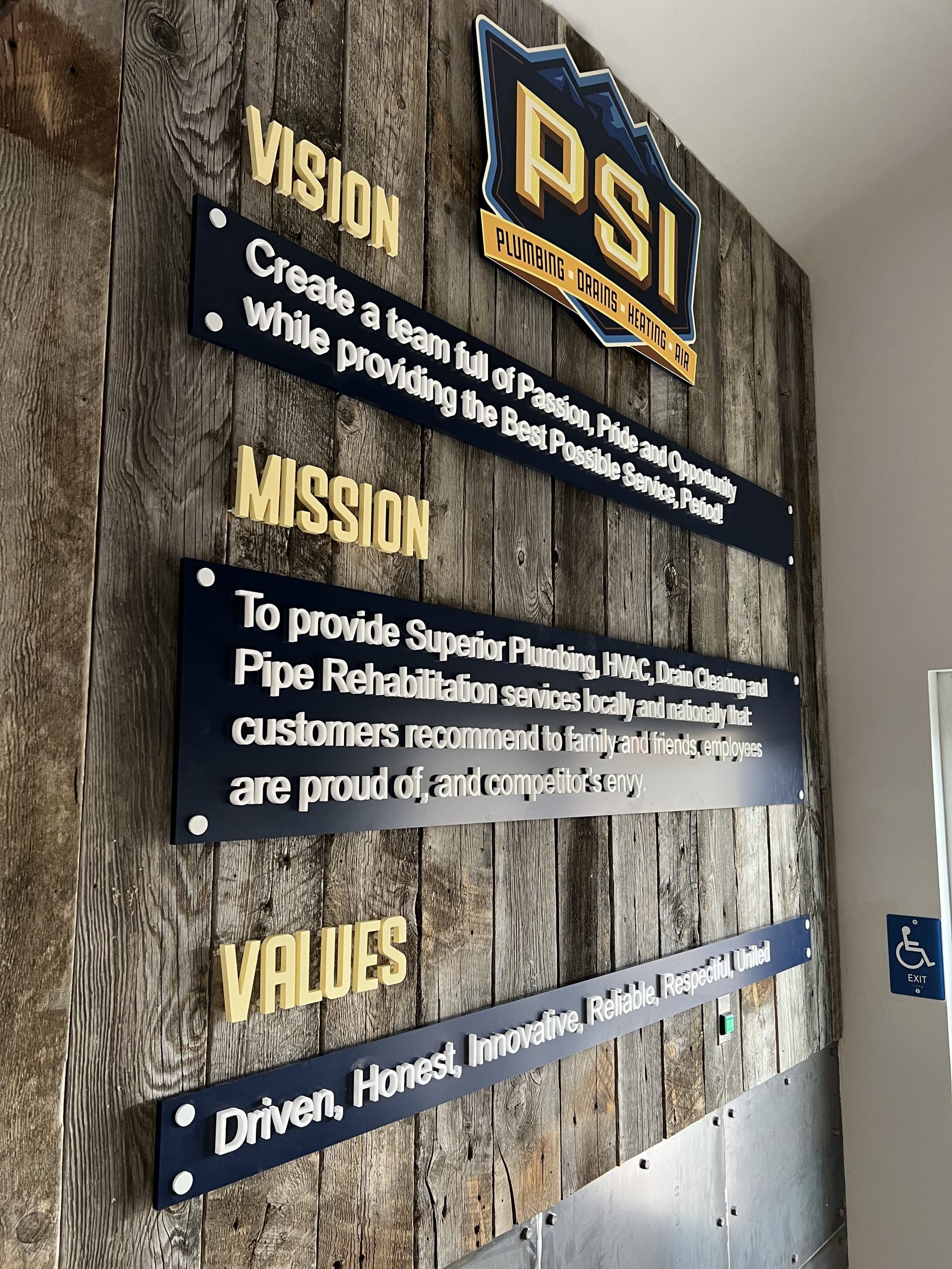 PSI office wall sign showcasing professional branding, enhancing cohesive identity in a modern workspace